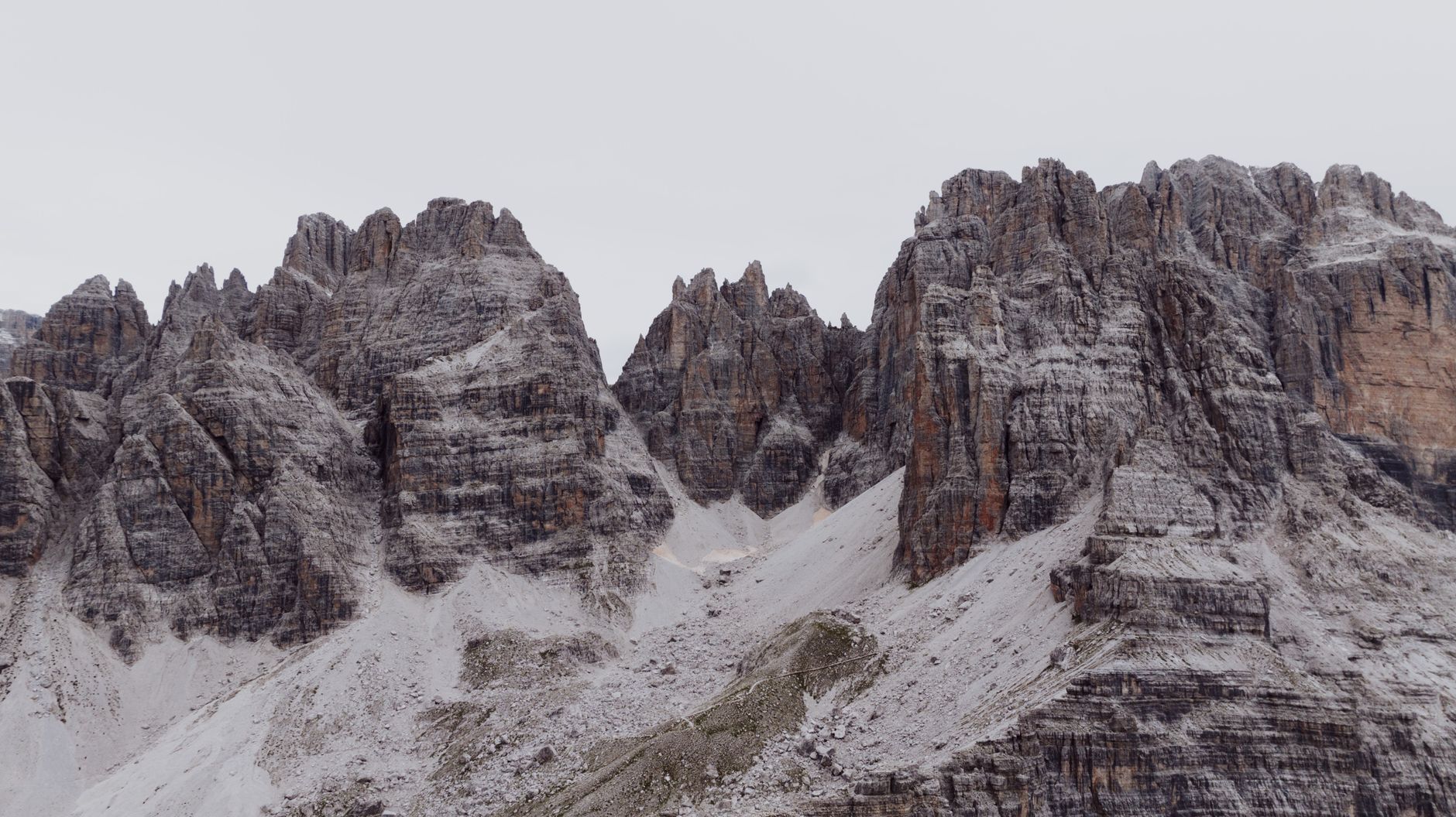 Dramatic Dolomite cliffs illuminated by warm alpine glow